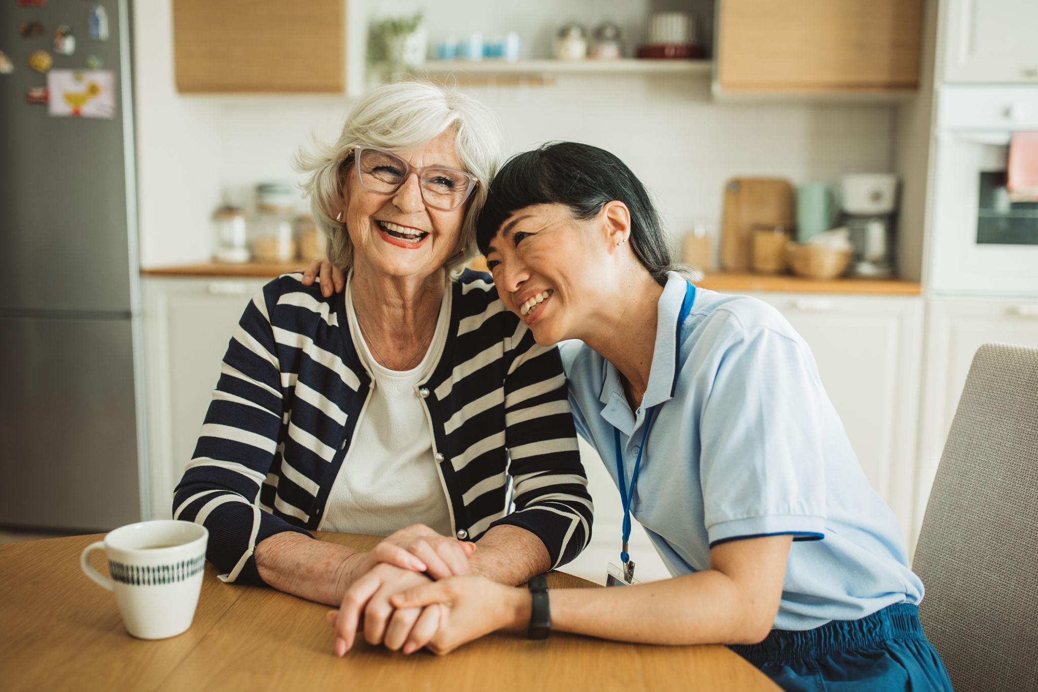 Caregiver sharing a warm moment with a client